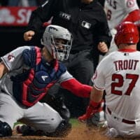 Mike Trout of Angels slides into home plate for a YRFI
