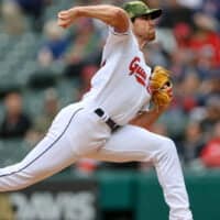 Shane Bieber of Cleveland Guardians pitches baseball