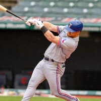 Texas Rangers Batter Hits Ball