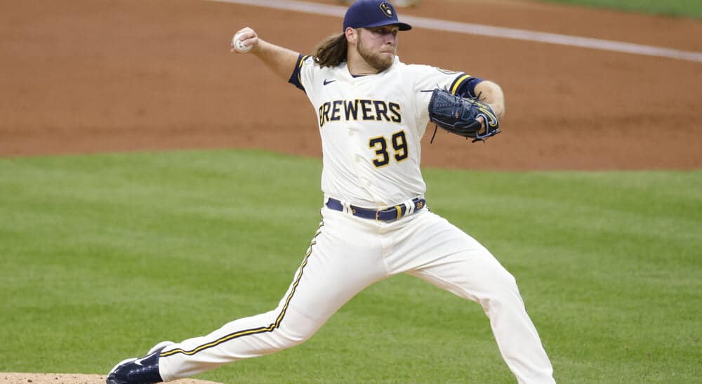 Corbin Burnes of Brewers pitches baseball pitches for a NRFI