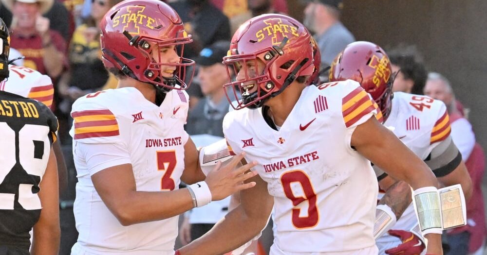 Iowa State quarterback Rocco Becht congratulates Iowa State wide receiver Jayden Higgins after his touchdown.